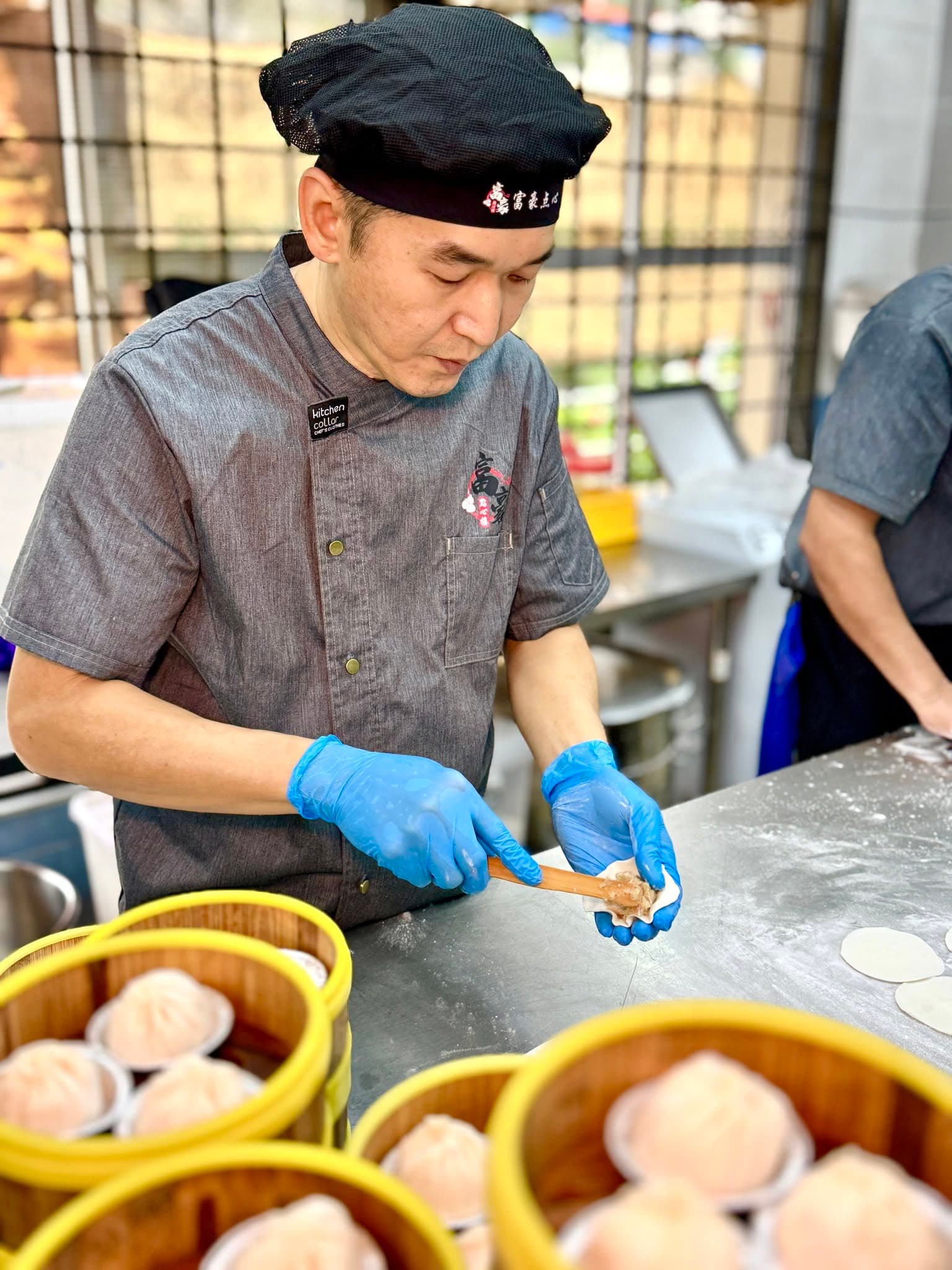 Foo Hou Dim Sum chef steaming handmade dim sum in traditional bamboo baskets